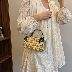 Gold quilted box handbag for women with metallic finish and decorative silk scarf handle