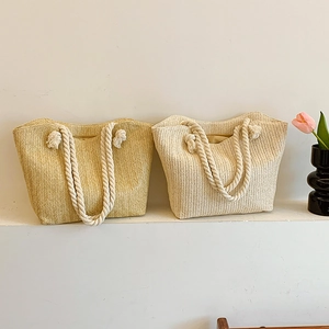 Straw woven tote bags in beige and yellow with cotton rope handles for summer beach
