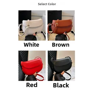 Crossbody saddle bags in white, brown, red, and black with adjustable gold hardware