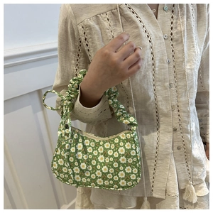 Detail of green floral hobo bag with white daisy print and pleated scrunchie handle