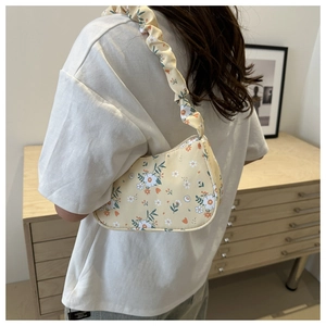 Floral pleated shoulder bag in yellow with small flower patterns and scrunchie strap