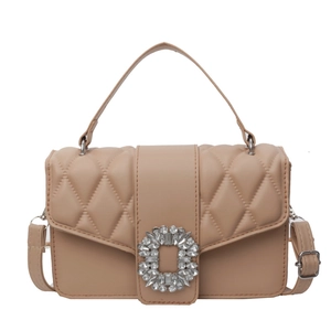 Quilted beige shoulder bag with sparkling rhinestone buckle and adjustable strap