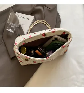 Interior view of the strawberry corduroy tote bag showing spacious capacity for daily items