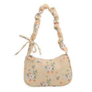 Floral print shoulder bag in yellow fabric with ruched strap and bow detail