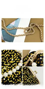 Detail of glitter sequins, faux pearls, and gold chain clasp on an elegant evening bag