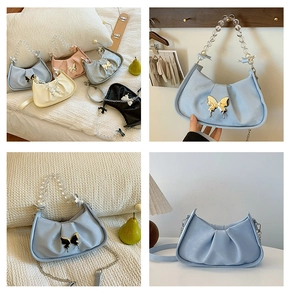 Detail of ruched shoulder bag with pearl chain and butterfly metal clasp in various colors