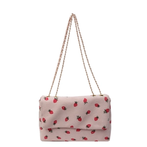 Pink corduroy strawberry tote bag with gold chain strap for casual summer fashion