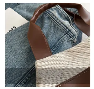 Detail of high-quality woven fabric and premium brown faux leather strap with precise stitching