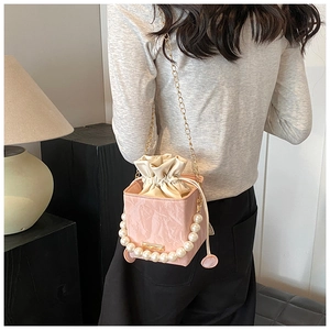 Pink PU bucket bag with marble texture, oversized pearl handle and drawstring pouch