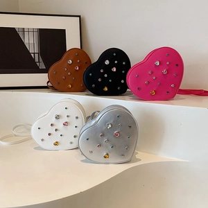 Sparkly heart-shaped rhinestone crossbody bags in brown, black, white, pink and silver