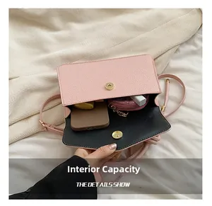 Internal capacity of pink litchi grain small crossbody bag showing phone and lipstick