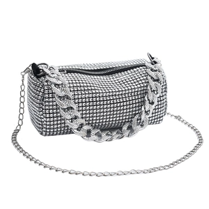 Sparkling silver rhinestone mini barrel bag with dual chain straps for evening parties