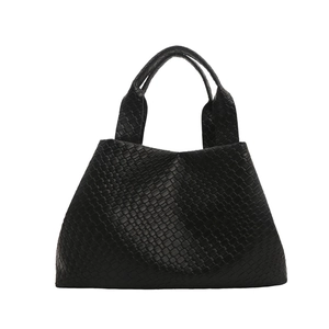 Minimalist black woven hobo handbag with classic leather weaving and dual top handles