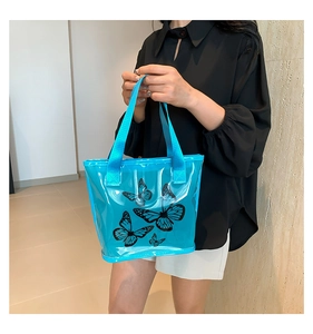 Blue semi-transparent tote bag with black butterfly prints for summer beach outings