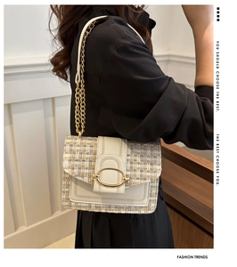 Detailed side view of woolen chain crossbody bag with golden buckle and woven texture