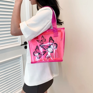 Pink transparent PVC tote bag with butterfly print and matching shoulder straps