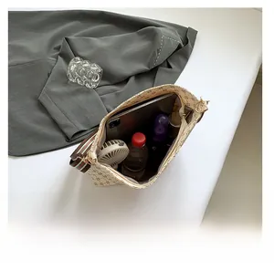 Close-up of the large capacity interior holding a tablet, water bottle and skincare items