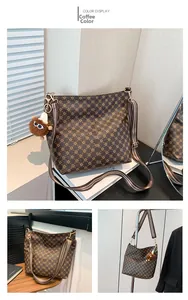Detail of coffee brown tote with star patterns and a colorful striped shoulder strap