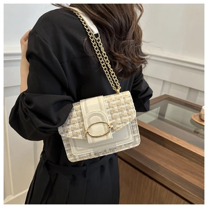 Elegant beige tweed woven crossbody bag with gold chain strap and large oval metal buckle