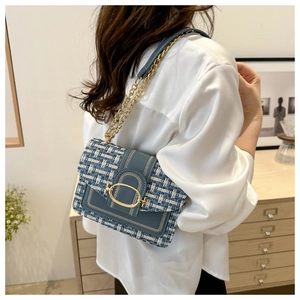 Blue and white tweed chain shoulder bag with gold oval clasp and crossbody strap