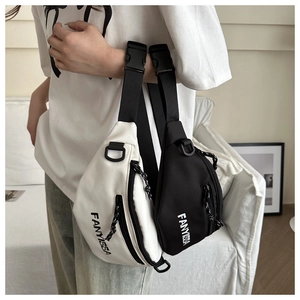 Detail showing two sports chest bags with adjustable straps and plastic buckles in soft light