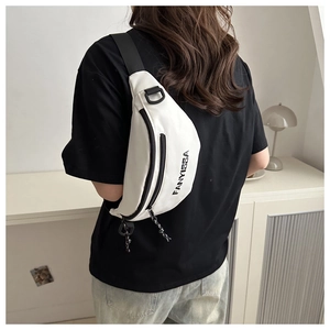 Close-up of white crossbody bag featuring black FANYISSA text and adjustable strap