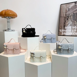 Classic Cambridge style satchel bags for women in five assorted pastel colors with charms