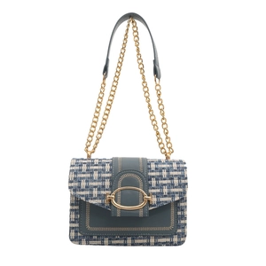 Elegant blue tweed crossbody bag with gold chain and oval buckle on white background