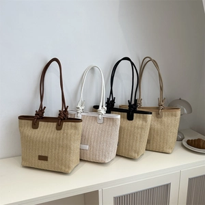 Summer woven beach tote bags in four colors with herringbone pattern and knot handles