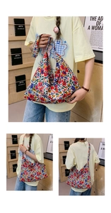Detailed macro view of vibrant floral nylon tote bag featuring wide comfortable shoulder straps