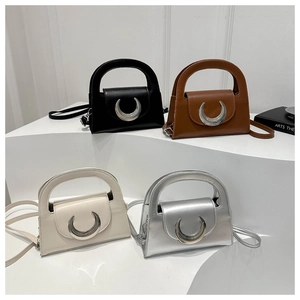 Chic mini square handbags in four colors with large crescent metal buckles on a white background