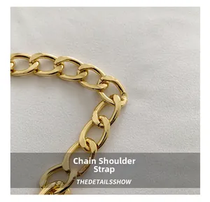 Detail of high-polish golden metal chain shoulder strap for stylish crossbody bags