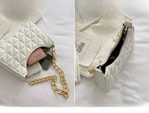 Internal view of the white quilted shoulder bag showing large capacity for essentials