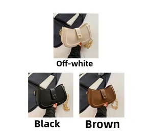 Three half-moon PU leather handbags in beige, black, and brown with gold chain detail