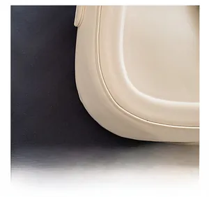Close-up of precise stitching and smooth leather texture on an off-white crossbody bag