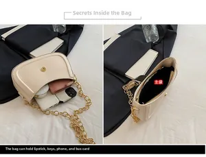 Internal view of cream shoulder bag showing capacity for phone, lipstick, and keys