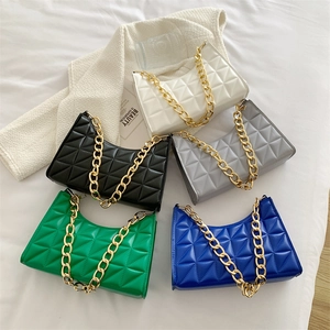 Five quilted faux leather underarm bags in various colors with thick gold chain straps