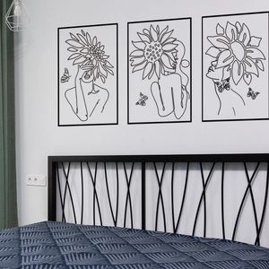 Three-piece modern wall art set featuring minimalist black line female face and sunflower art