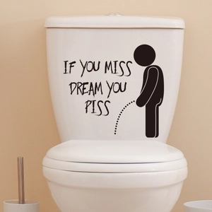 Detail of funny bathroom wall sticker with boy silhouette on toilet tank