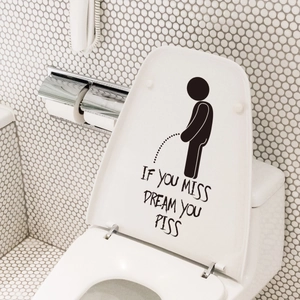Funny silhouette sticker with humor quote applied on a white toilet lid bathroom decor