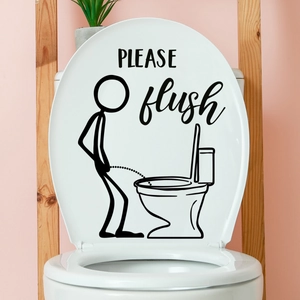 Funny stickman toilet sticker with PLEASE flush text on a white lid in a pink bathroom