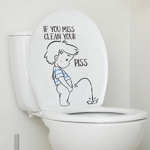 Funny cartoon boy sticker with reminder text on a white ceramic toilet lid for bathroom decor
