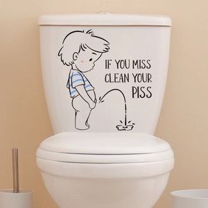 Funny cartoon boy toilet sticker on a white tank with clear humorous text detail