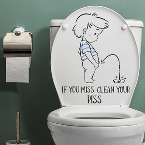 Funny boy toilet lid sticker with 'If you miss clean your piss' text on green wall