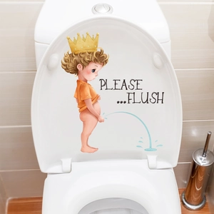 Detail of creative cartoon boy toilet sticker with Please Flush text on white lid