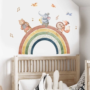 Cartoon animals playing instruments on a rainbow wall sticker for nursery decor