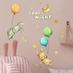 Detailed view of watercolor bunny wall stickers with golden stars and moon set for nursery