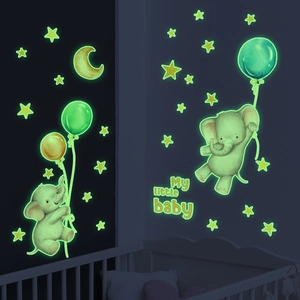 Glow in the dark wall stickers featuring cartoon elephants, moon and stars in nursery