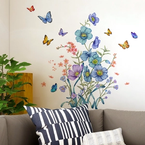 Detail of blue floral wall stickers and painted butterflies on a living room wall