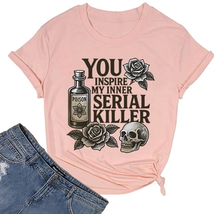 Macro detail of gothic print and side-knot design on light pink cotton T-shirt
